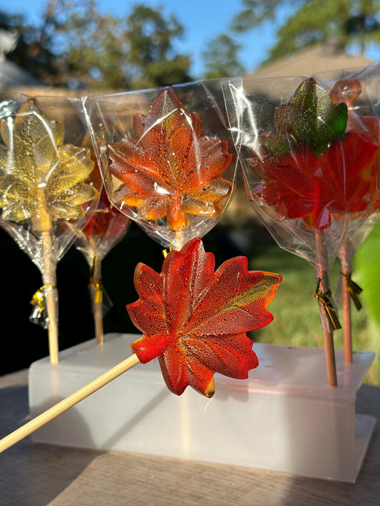 Handmade maple leaf lollipops in red, orange, yellow and green, individually wrapped