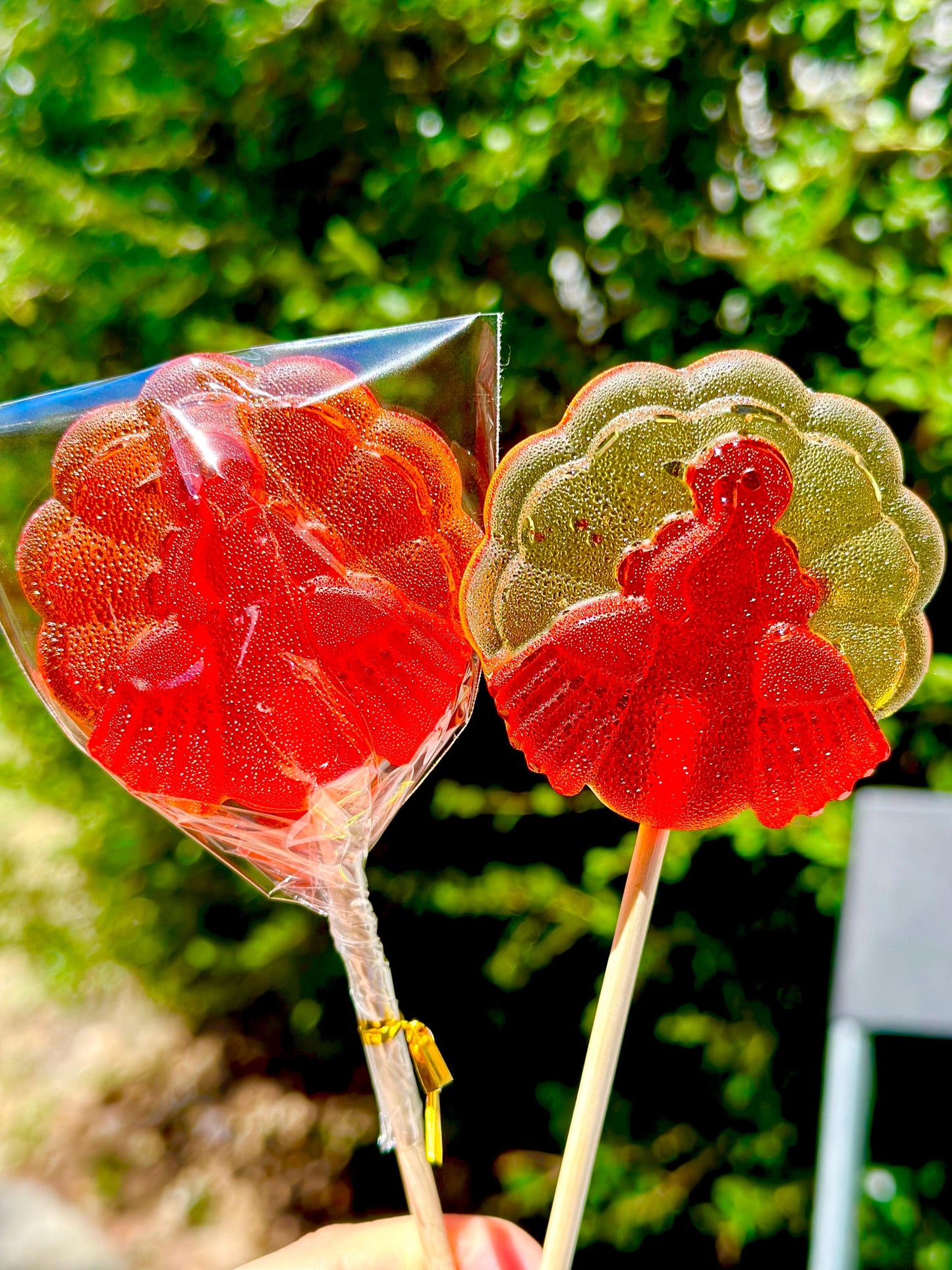 Two autumn lollipops in red and yellow translucent candy