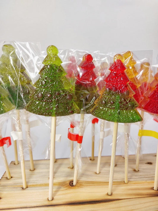 Handmade Christmas tree lollipops in bright green and red clear candy, individually wrapped