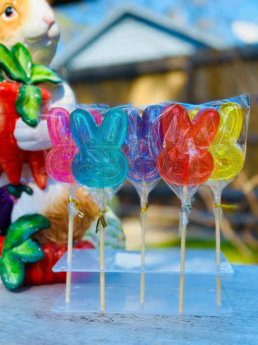 Six handmade bunny lollipops in pink, blue, purple, red, yellow and orange clear candy